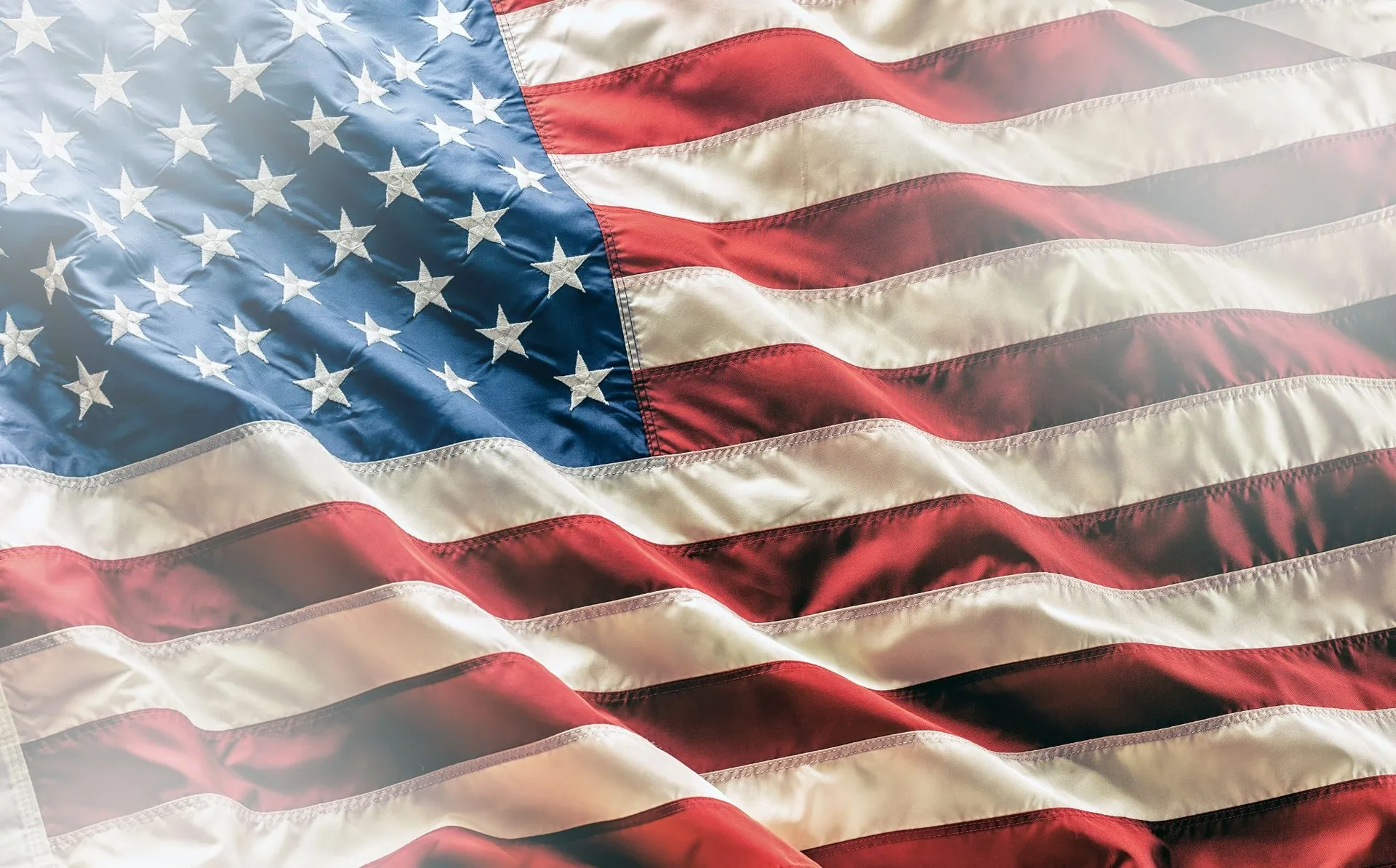 Close-up of an American flag waving, representing USA Quality Painting